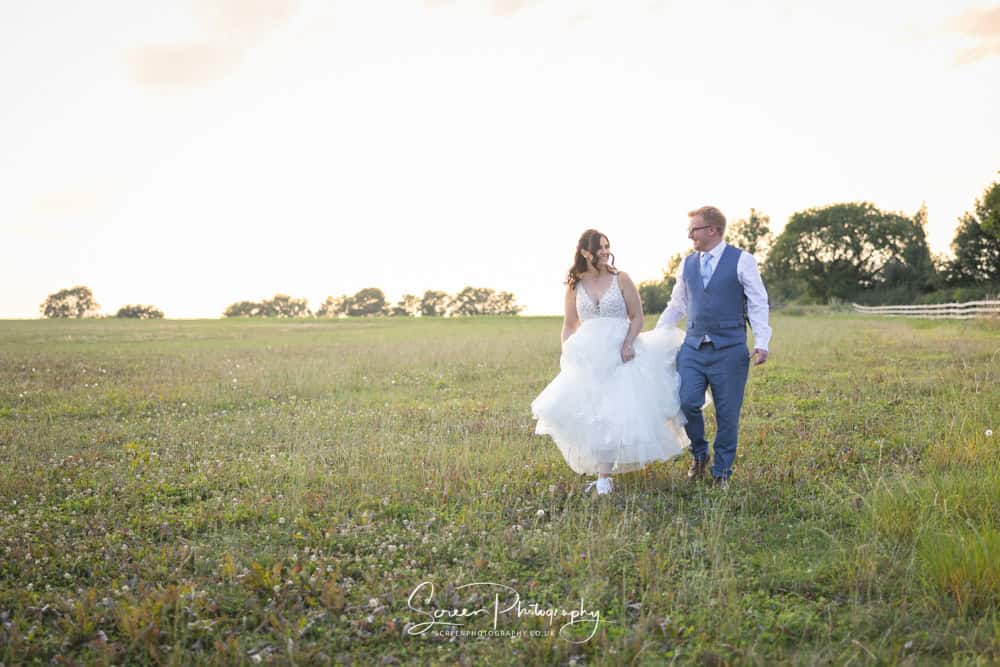 Donington Park Farmhouse sunset wedding photography in field
